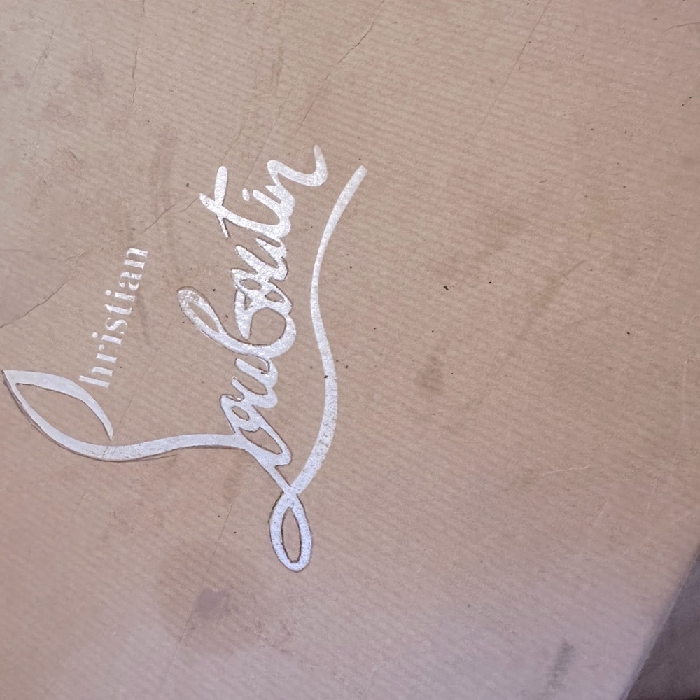 Christian Louboutins red bottom tennis shoes